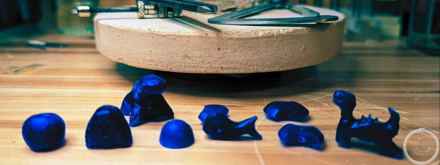 Different wax materials standing on top of a wooden table