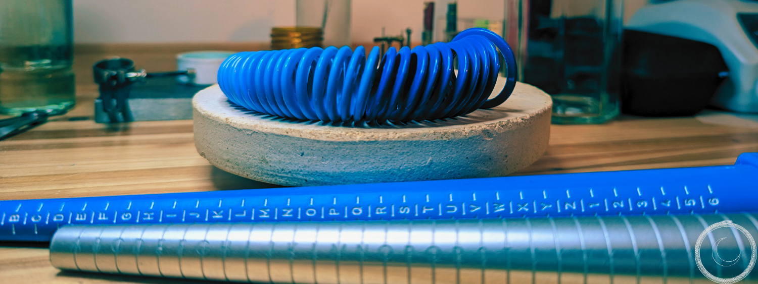 Ring sizer on top of a wooden table in a different angle