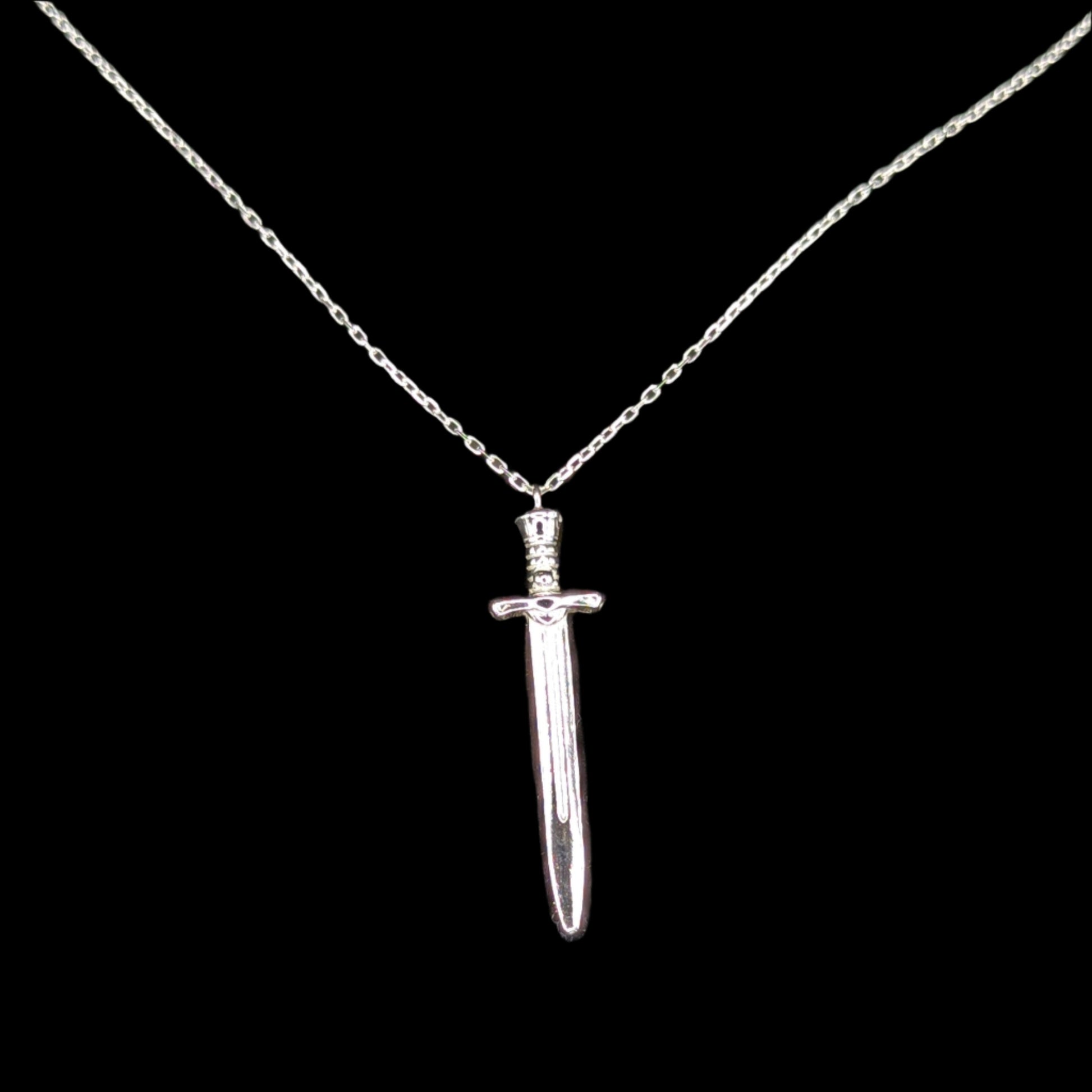 Silver sword-shaped pendant on a chain against a black background